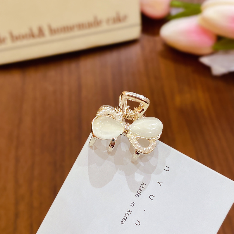 Pajarita doble ojo de gato-dorado