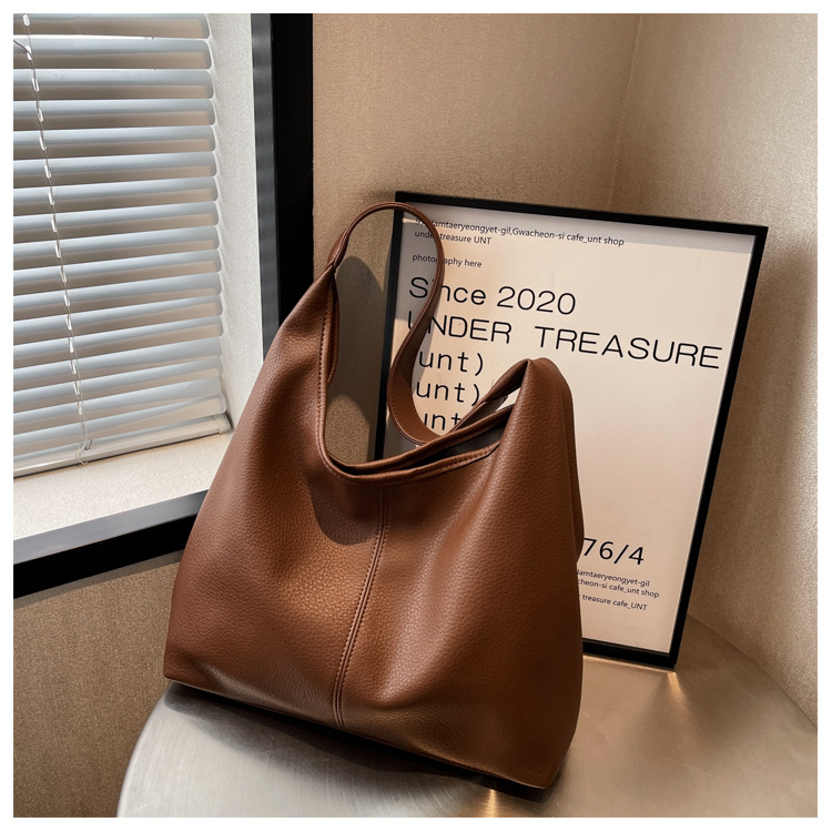 Bolsos de gran capacidad para mujeres primavera y verano 2025 nuevos bolsos de hombro de moda de alta calidad cubos de agua para niños y madres bolsa especial de cercanías