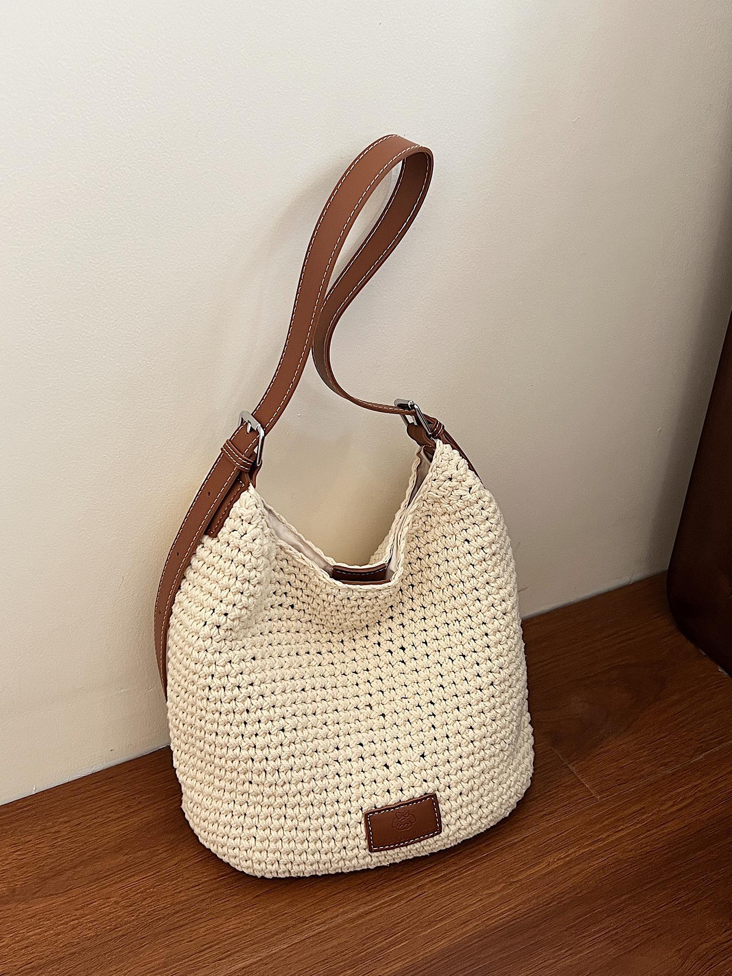 Bolso tejido hueco de estilo explosivo de verano para mujer de gran capacidad 2025 nuevo estilo de ocio junto al mar estilo vacaciones bolso tejido de paja de cercanías