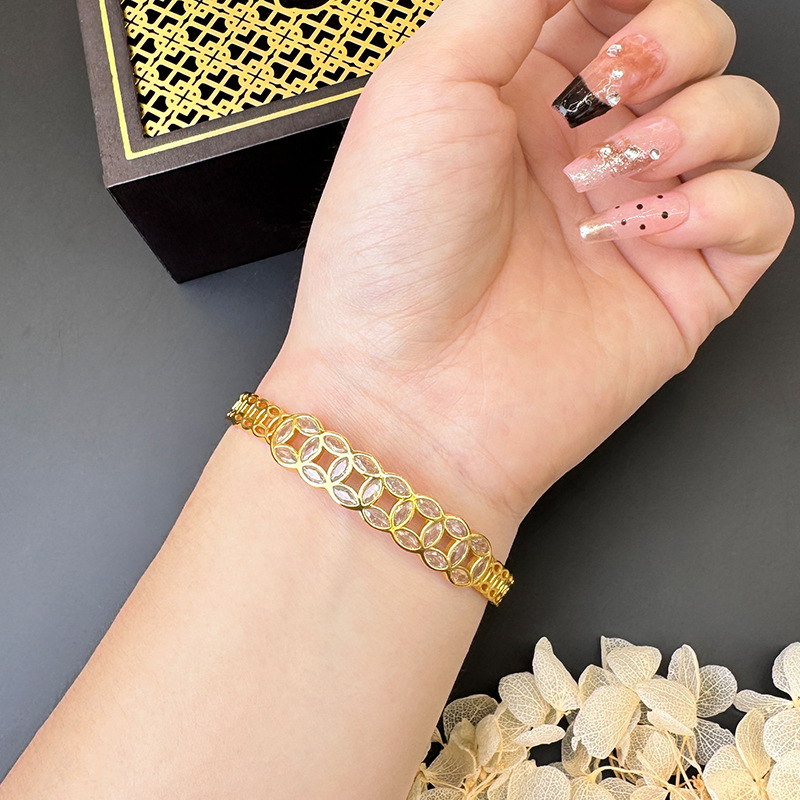 Dinero de bronce de estilo nacional de oro de Vietnam hueco micro brazalete de fijación no se desvanecerá durante mucho tiempo lujo ligero y alta sensación de joyería suministro