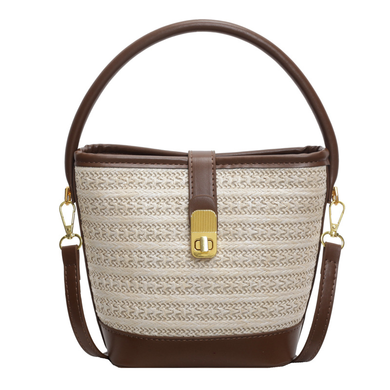 Verano popular bolso de cubo de mano super caliente para mujeres 2025 nuevo estilo de moda simple tejido de alta sensación de hombro mochila