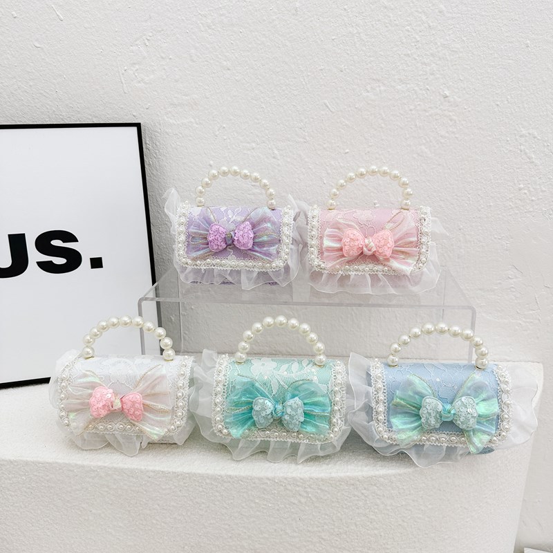 Estilo occidental princesa bandolera moda pequeña fragancia bowknot bandolera para niños y niñas nueva cadena mini bolso para niños