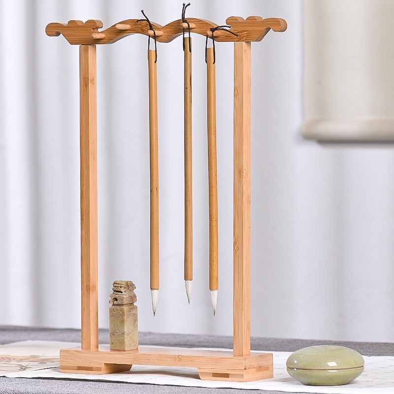文房四宝の実木の筆立ての手羽の木の筆立ての蛇口のペンは書道の筆を掛けてプラスチックの蛇口のペンを掛けます。|undefined