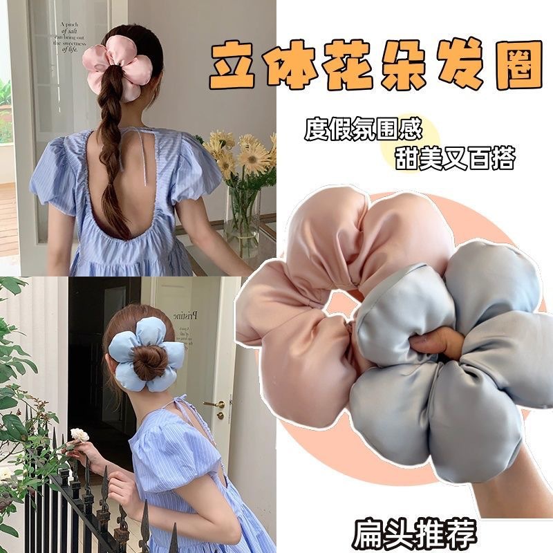 Extra-large 3D flower hair tie with a luxurious satin finish, creating a sophisticated ambiance for women's bun and ponytail hair accessories.