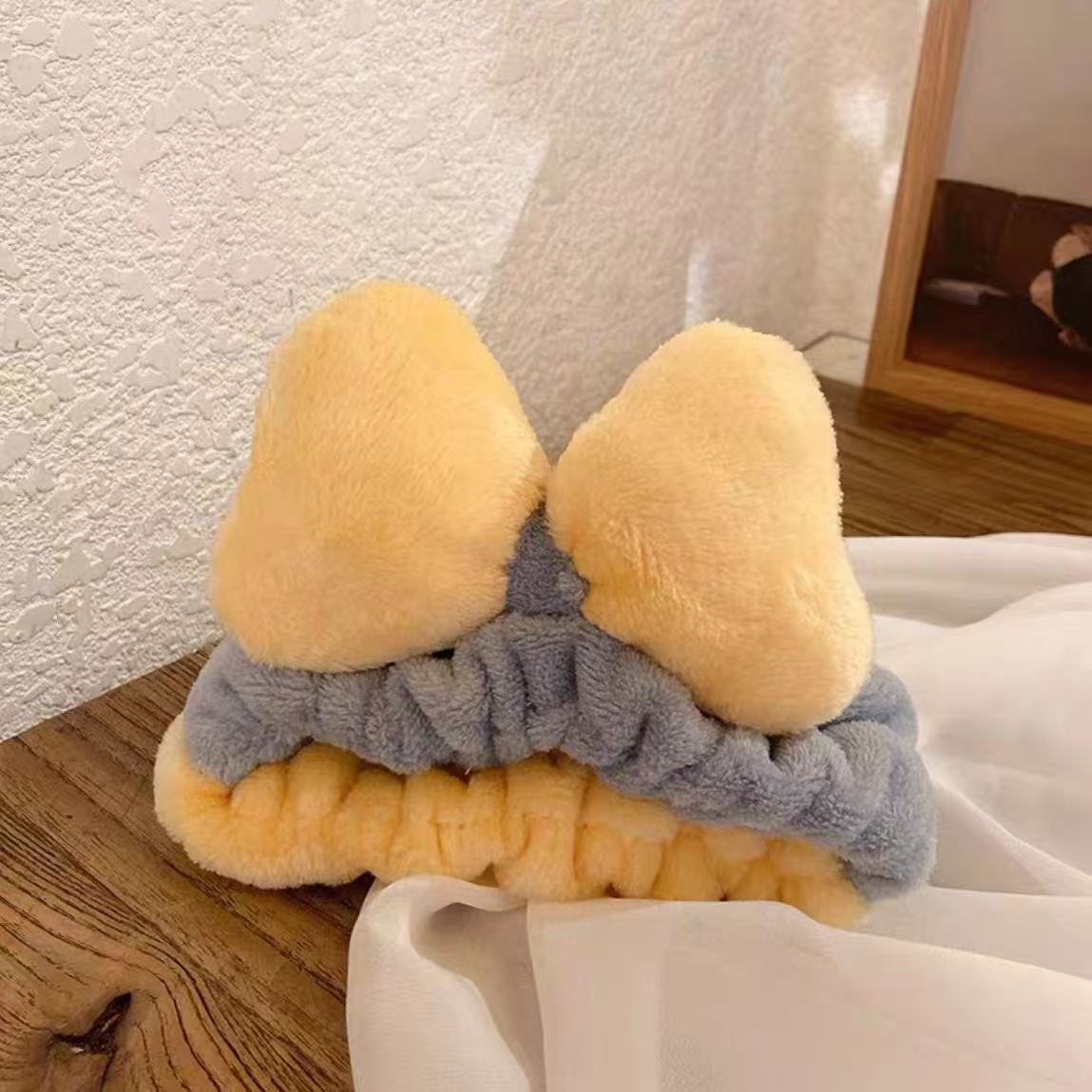 Otoño y invierno dibujos animados peluche lavar la cara cinturón de cabello máscara de mujer lavar la cara cinturón de cabello impermeable estereoscópico impermeable adornamientos de cabello al por mayor