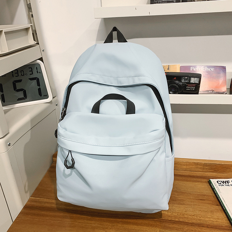 Las chicas japonesas de bolsos de lona son antiguas, impermeables, de color sólido, bolsos de nylon, Campus simple y versátil mochilas escolares para hombres de moda.