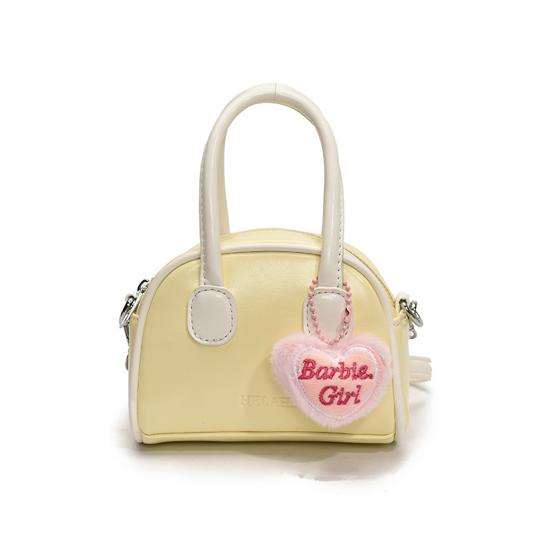 Bolsos coreanos para niños y niñas conchas de aire extranjero mini bolsos de mano de bebé de color sólido dulces bolsos para niños colgantes