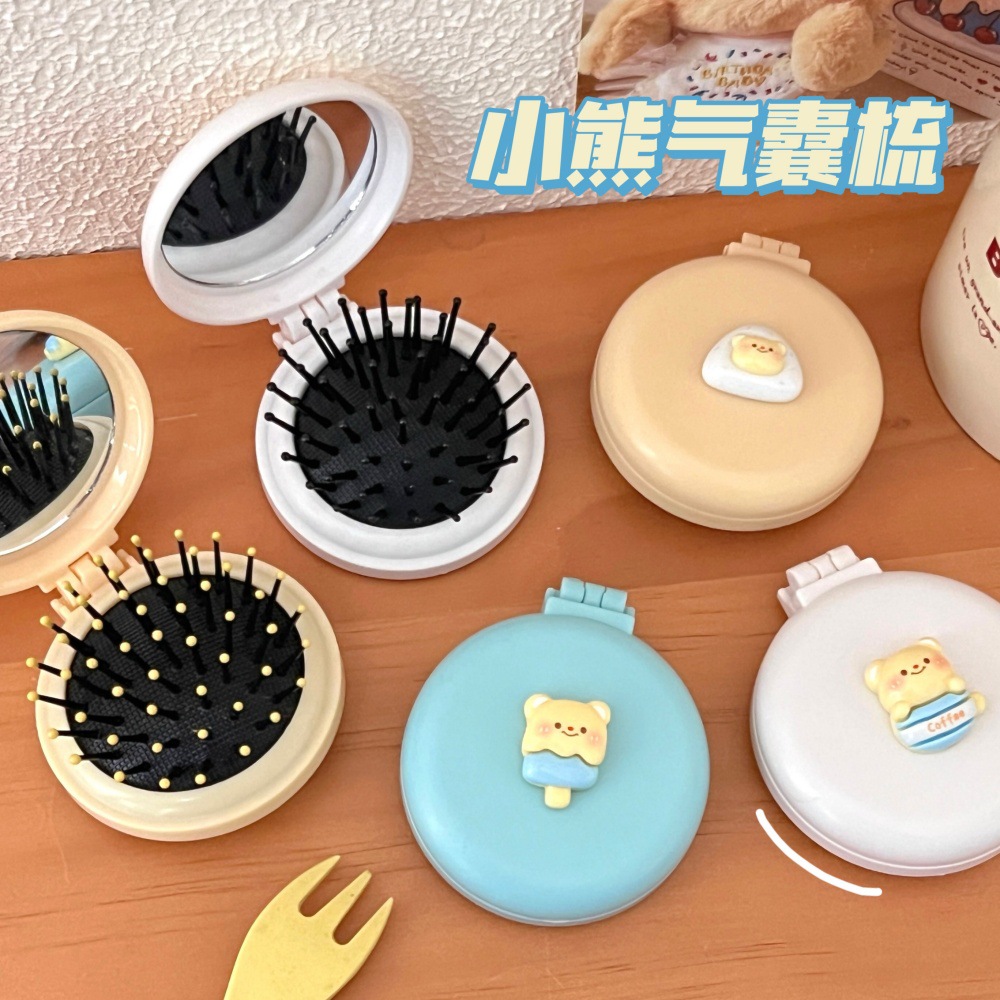 Caricatura encantadora oso plegable un solo espejo pein de corazón de niña portátil mini pequeño espejo de maquillaje de aire pantalon