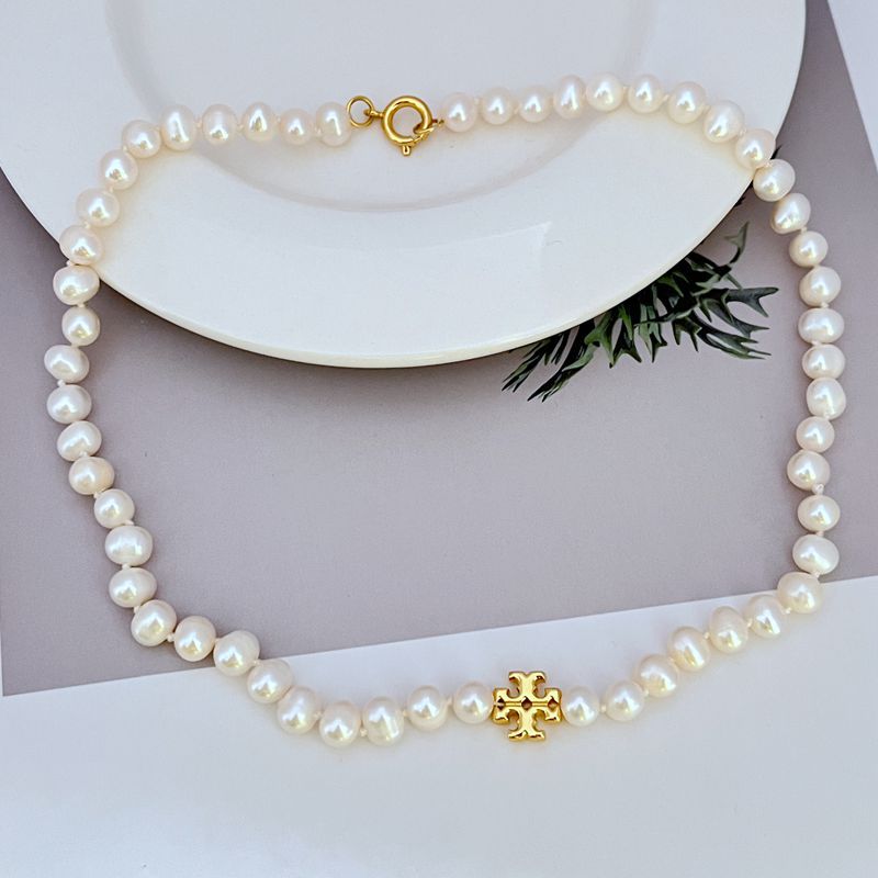 Fashionable elegant necklace from pearl with letters