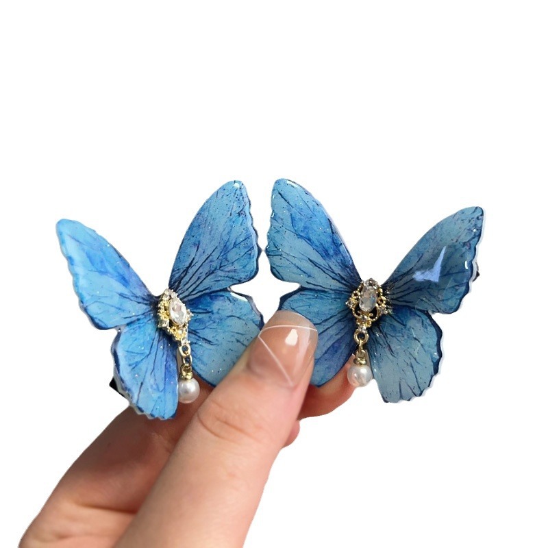 Horquilla de diamantes con incrustaciones de perlas de mariposa Clip de pico de pato lateral simple coreano de alta calidad, fresco y versátil, horquilla, accesorios para el cabello al por mayor