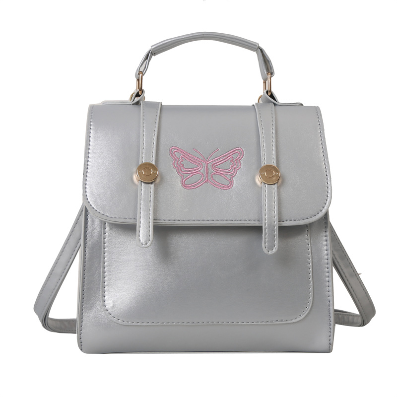 Estilo británico estilo coreano diseño de nicho ins hombro mochila bolso de las mujeres bolsa de cubo estilo universitario 2023 nueva bolsa de mensajero