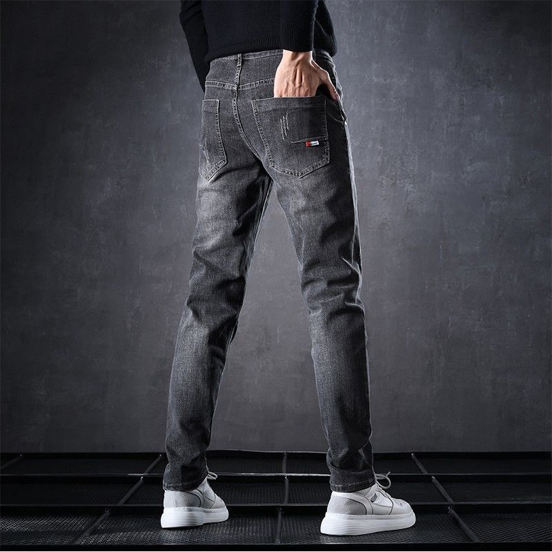 Jeans de lana para hombre otoño y invierno 2026 estilo recto suelto elástico alto calentamiento marca de moda pantalones casuales