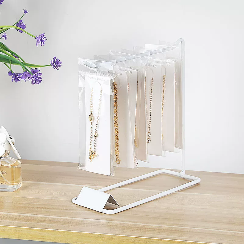 Стойка? Нет. Перевод: Stand, earrings, storage system, bracelet, necklace, hair accessory, simple and elegant design