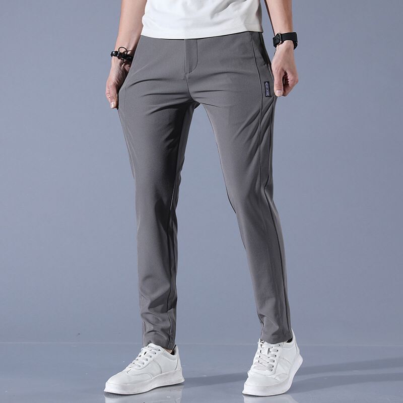 2023 pantalones casuales para hombres primavera y verano estilo coreano estiramiento de moda Pantalones slim fit pies de seda de hielo cintura elástica pantalones de color sólido para hombres