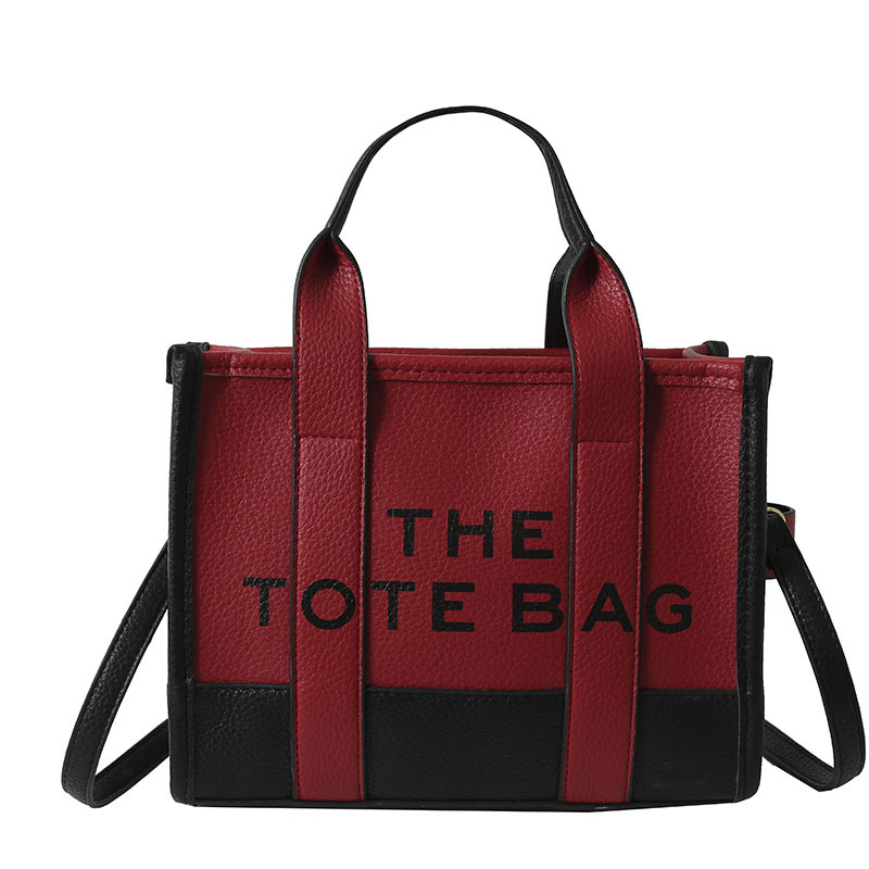 Bolso tote de comercio exterior para mujer 2023, nuevo bolso de mano moderno europeo y americano, bolso bandolera con estampado de letras y bloques de color.