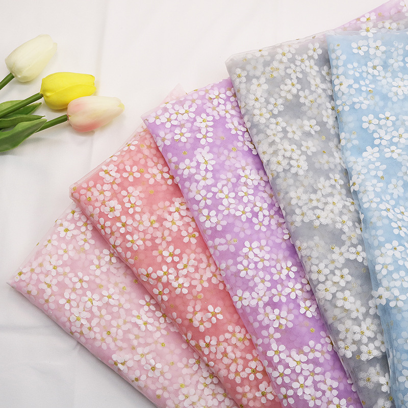 跨境现货幻彩金点小梅花薄纱网布面料儿童裙服装圣诞婚礼装饰面料