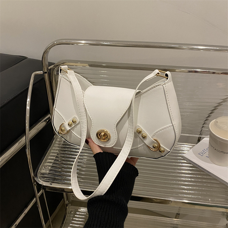 Bolsa de bolinillos retro chica caliente un hombro bolso de mochila para mujeres 2025 nuevo diseño locomotora de cierre de viento bolso de brazo