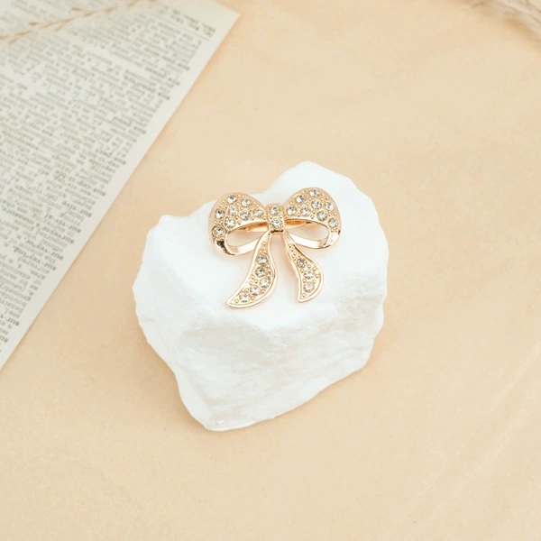 With bow, diamond encrusted