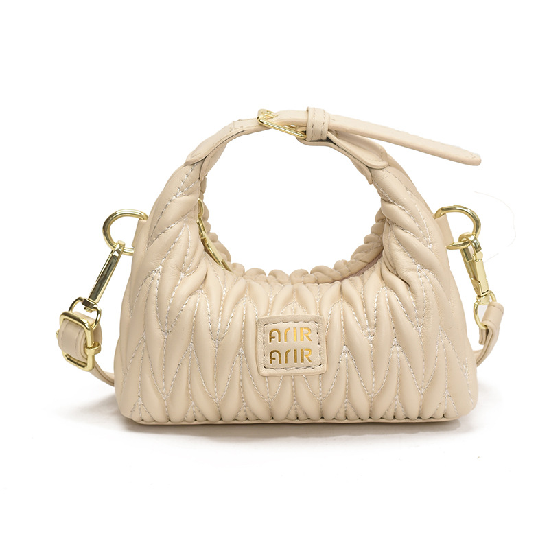 Bolsa de hombro de chicas plegadas de moda simple color sólido mini bolso de bebé 2025 nuevo bolso infantil transfronterizo