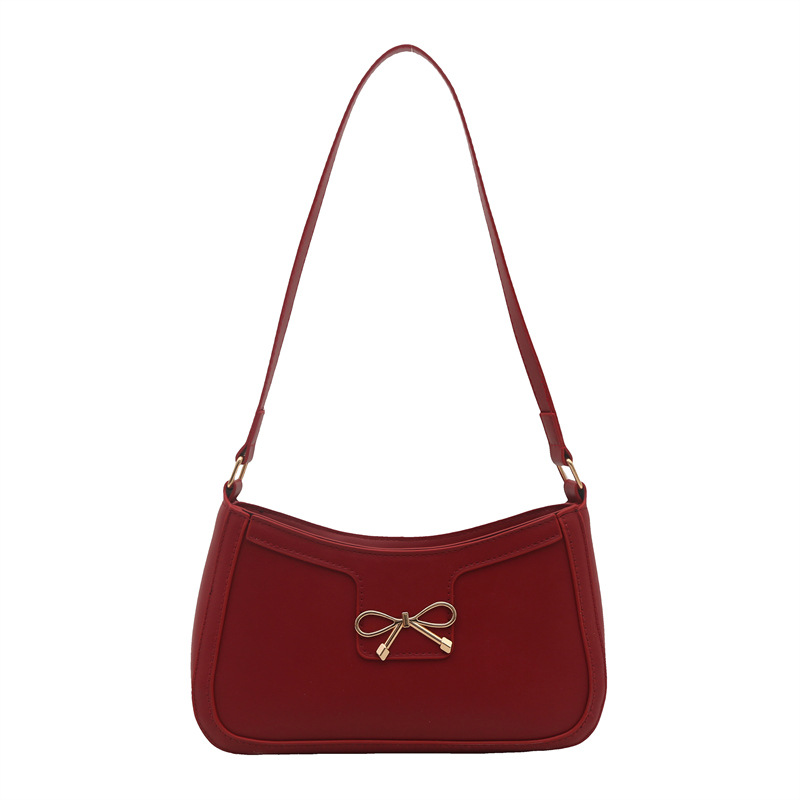 Bolso de hombro popular de este año con lazo para damas de gran capacidad 2025 color sólido nuevo bolso de axila simple de textura de moda