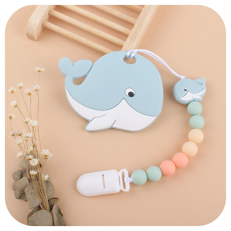 Amazon nuevo bebé ballena de silicona chupete Cadena de dientes de bebé Cadena de molienda calmante cadena anti-caída