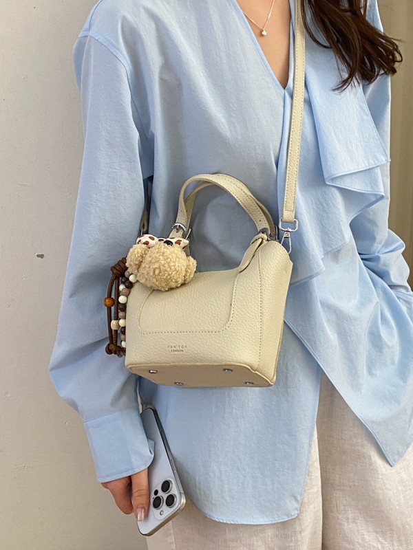 2026 nueva moda versátil cesta de verduras portátil bolso de cubo de agua de alta calidad litchi patrón ligero bolso de lujo bolso de mochila