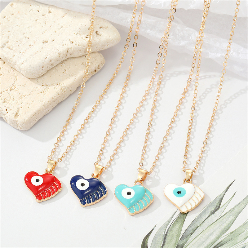 Fashion Alloy Drip Oil Color Eyes Wings Heart Necklace Peach Heart Devil Eye Necklace display picture 1