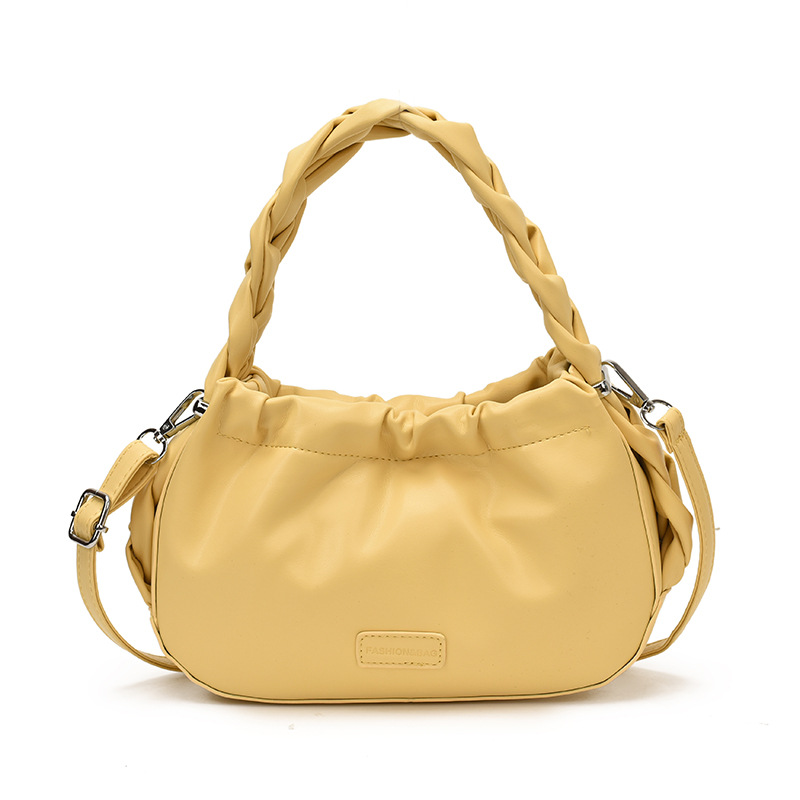 Corea del Sur nueva bolsa de mano plegada mujer 2026 primavera nicho versátil bolso de mochila simple de moda bolsa de nube de viaje