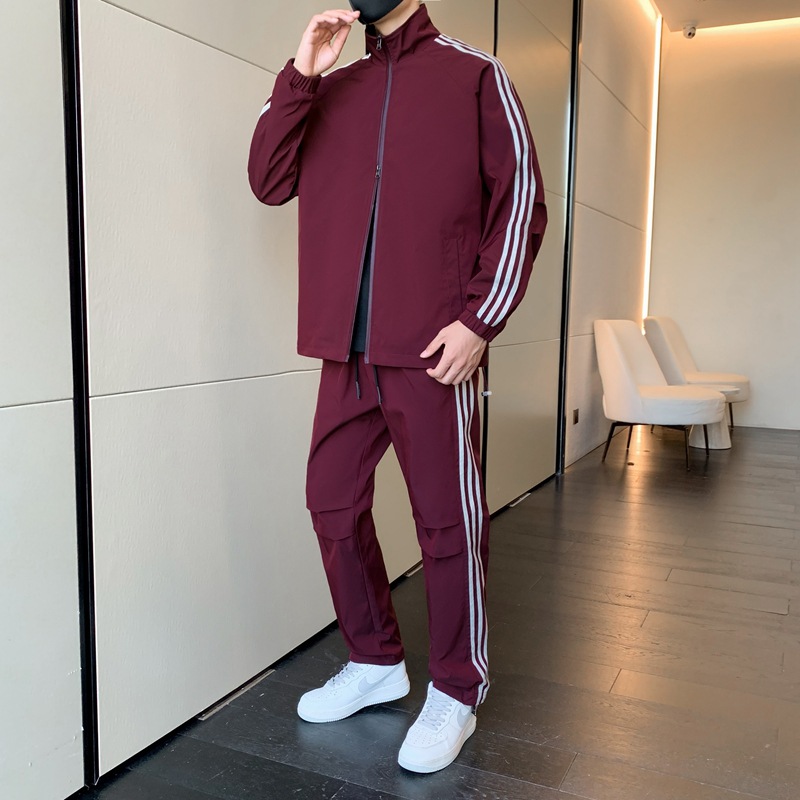 Primavera y otoño transfronterizos chaqueta delgada ropa deportiva hombre ocio tres barras juego de deporte de correr al aire libre dos piezas juego de comercio exterior
