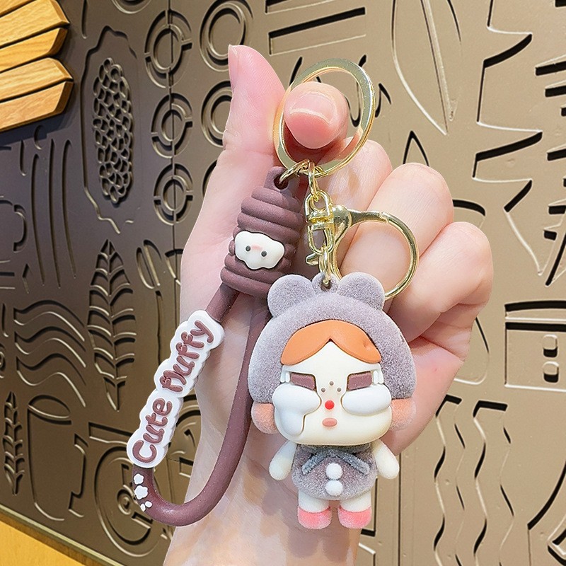 Muñeca de dibujos animados goteo llavero bolsas escolares exquisitas para hombres y mujeres colgantes para agarrar muñecas colgantes para el mercado nocturno regalos al por mayor