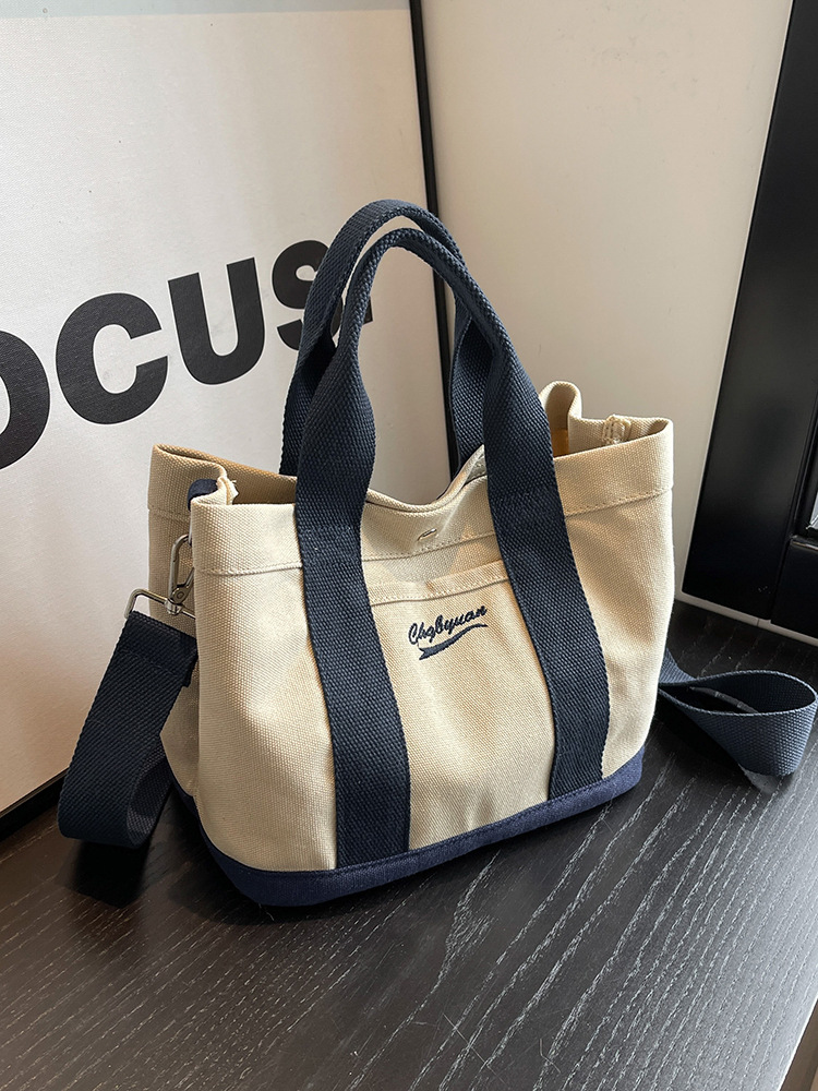 Bolso de hombro para mujer de nicho nuevo para otoño 2023, estilo coreano de internet, bolso de lona casual de mano, bandolera versátil para estudiantes