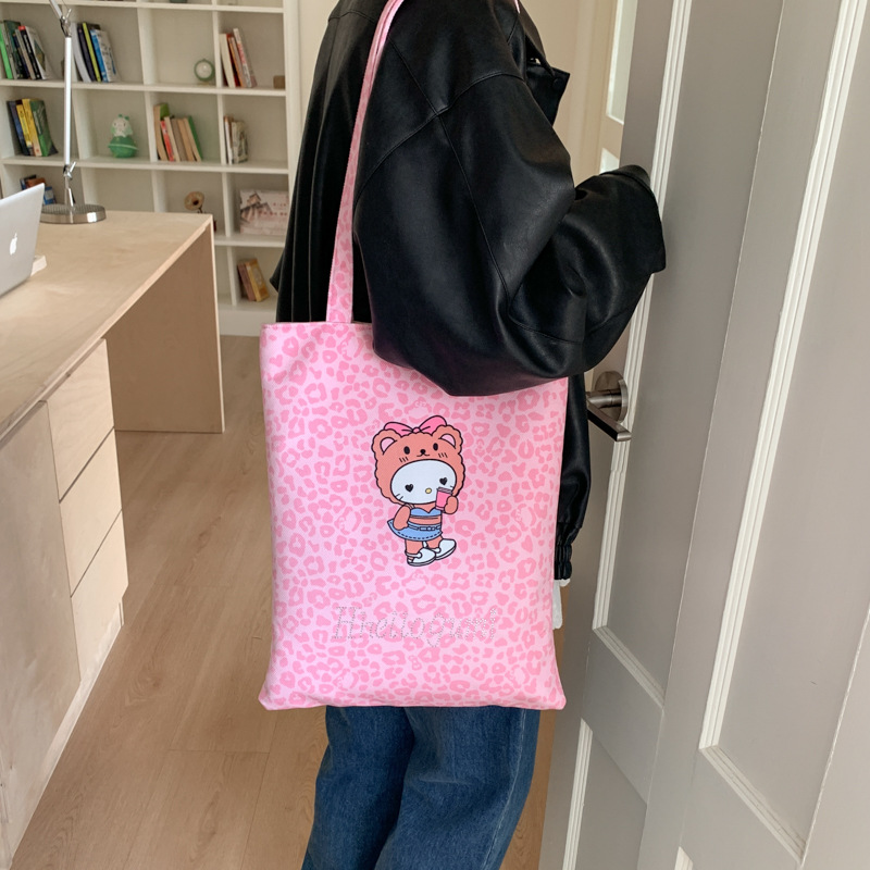 Bolsa de moda de balde, bolso de lona universal, mujer, otoño y invierno 2025, nuevo modelo de bolso de hombro con patrón de leopardo, bolso de brazo de viaje