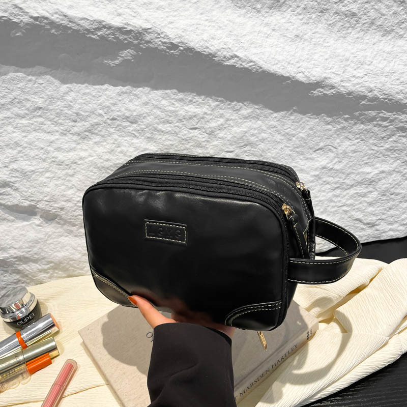 2025 nuevo paquete de lavado multicapa de gran capacidad, bolsas de maquillaje comerciales simples, bolsas de almacenamiento multifuncionales para viajes de cuero pu