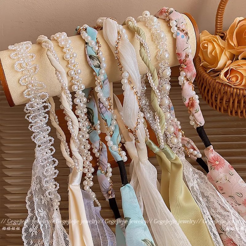 Perla de alta sensación trenzada banda de cabello de mujer banda de cabello flotante integrada banda de cabello temperamento fuera de la varilla cabeza de tarjeta