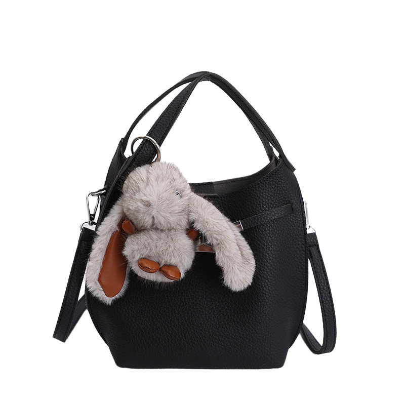 Bolso de mujer nuevo estilo coreano nicho de moda lichi bolso de cubo portátil de alta sensación de ocio mochila de viaje