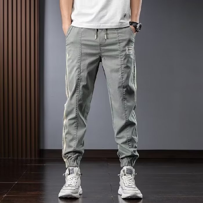 Pantalones de herramientas para hombres, modelos de primavera y otoño, moda de marca de moda, otoño delgado, pies sueltos, pantalones vaqueros de talla grande en forma de cono Harlan para hombres