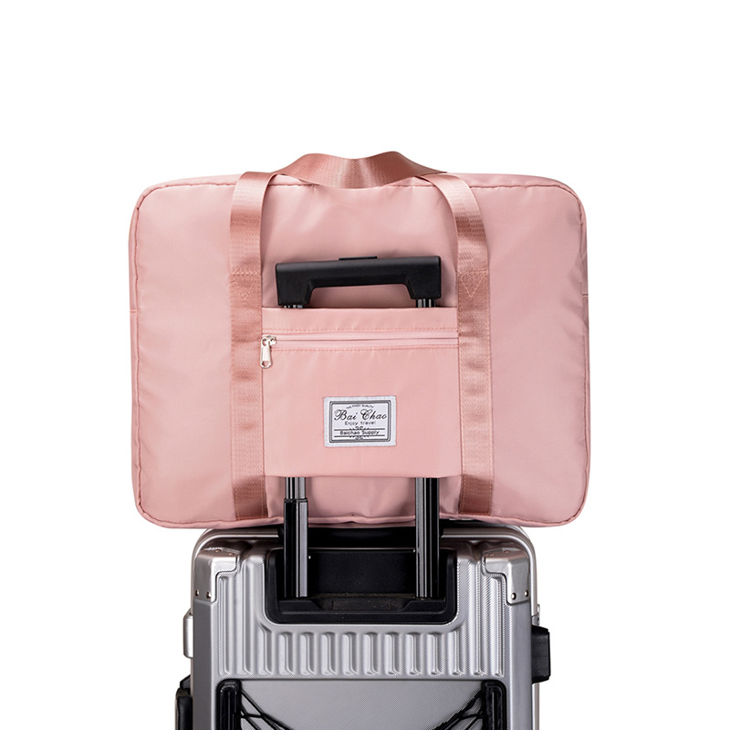 Bolsa de viaje para mujer bolsa de lona de corta distancia de gran capacidad, maleta portátil que se puede usar con ruedas, bolsa de almacenamiento de ropa ultragrande y liviana para la producción