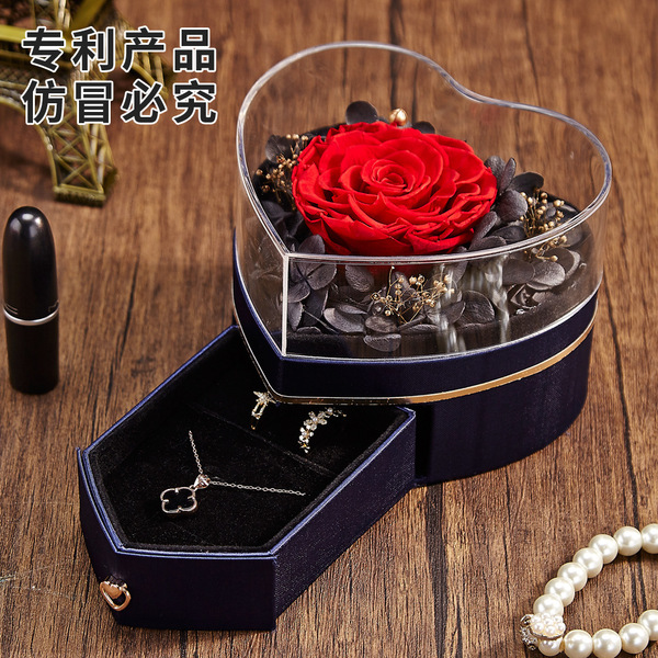 Acrylic ring heart shaped contains rose