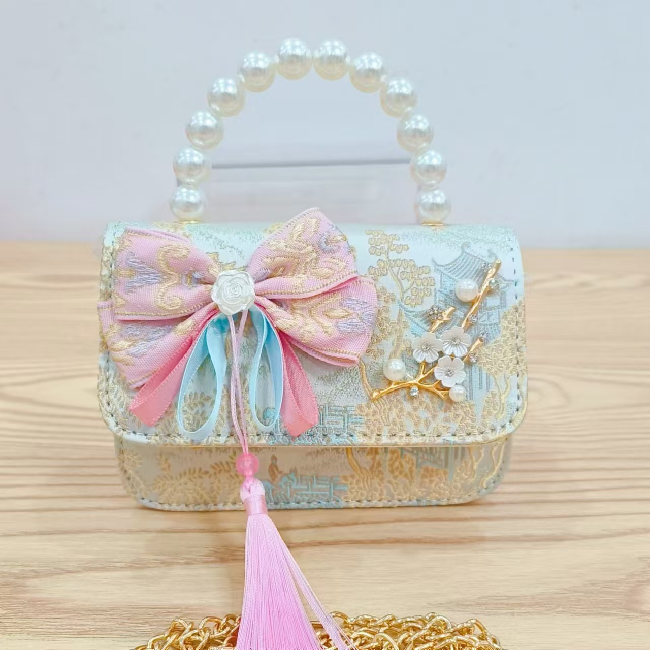 Bolsas de niños arco de estilo chino borda de niña pequeña princesa perla bolsa de cambio de mano al por mayor