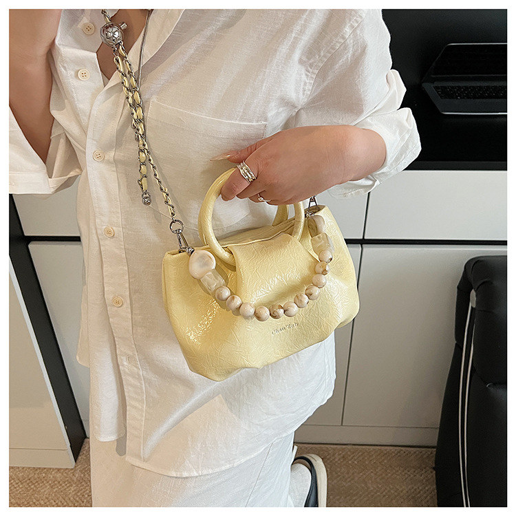 A stylish and trendy beaded bag for women, a new summer chain crossbody cloud bag for women in 2025 undefined