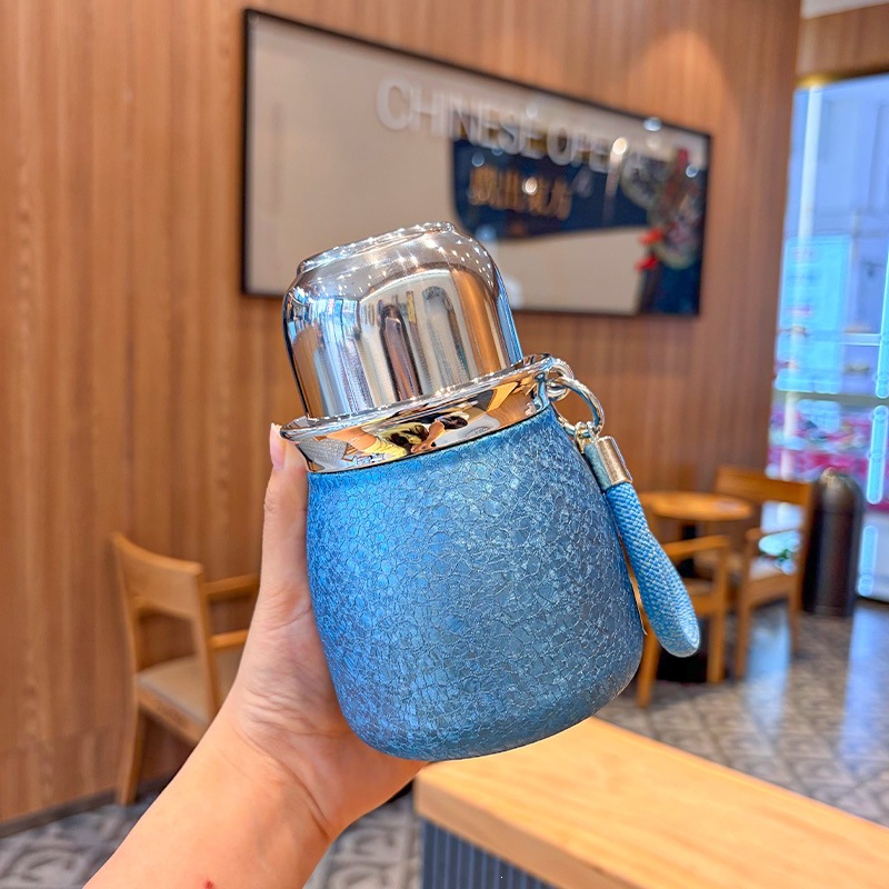 Taza de aislamiento térmico de calabaza de titanio yuanbao taza de té Fulu separación de agua de tres bebidas taza de agua de aislamiento térmico taza de té de cocción taza de té de aislamiento térmico taza de té