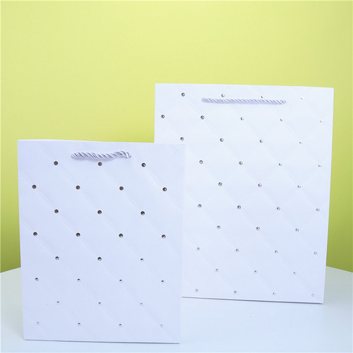 Gold foil embossed white card gift bag single color round dot gold foil hand-held paper bag foreign trade packaging paper bag