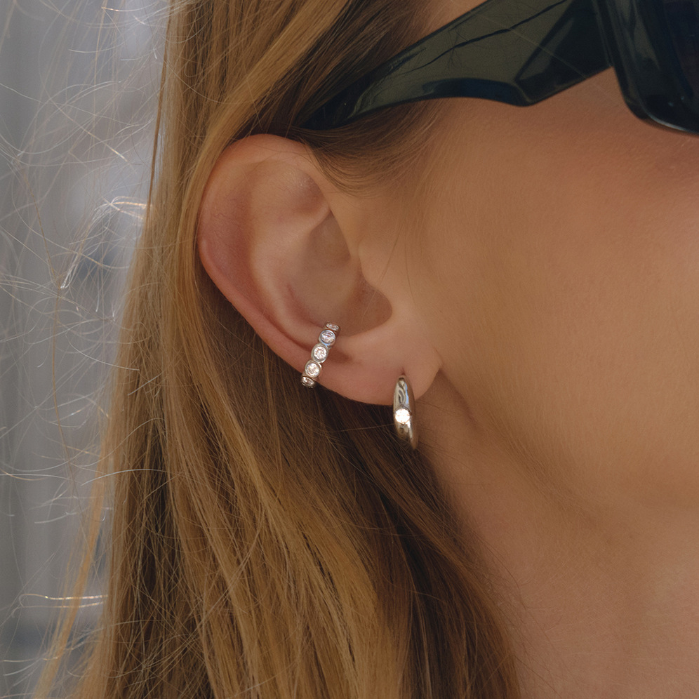Wanxing europa y americana pendientes de zircon blanco ligero lujo alto sentido de joyería transfronteriza nicho diseño pendientes de acero inoxidable