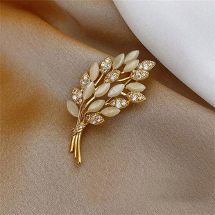 New European and American cat's eye stone diamond wheat brooch women's anti-light buckle pin fixed clothes accessories women