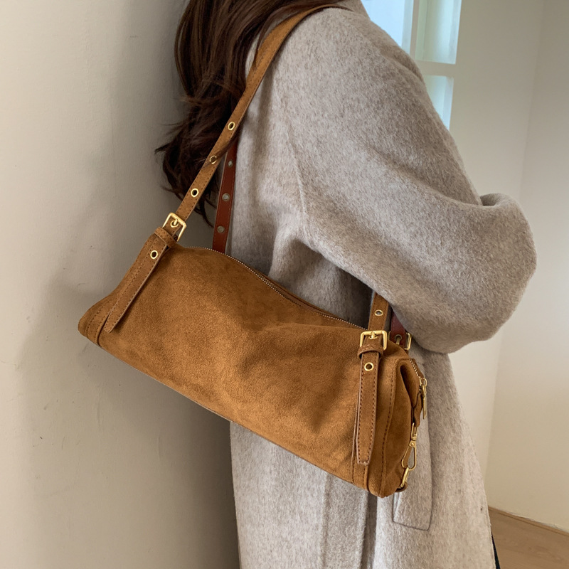 Otoño e invierno lazo bolsa de viento para mujeres 2025 nuevo retro cuero blando hombro brazo bolso de almohada de viaje bolso de mano