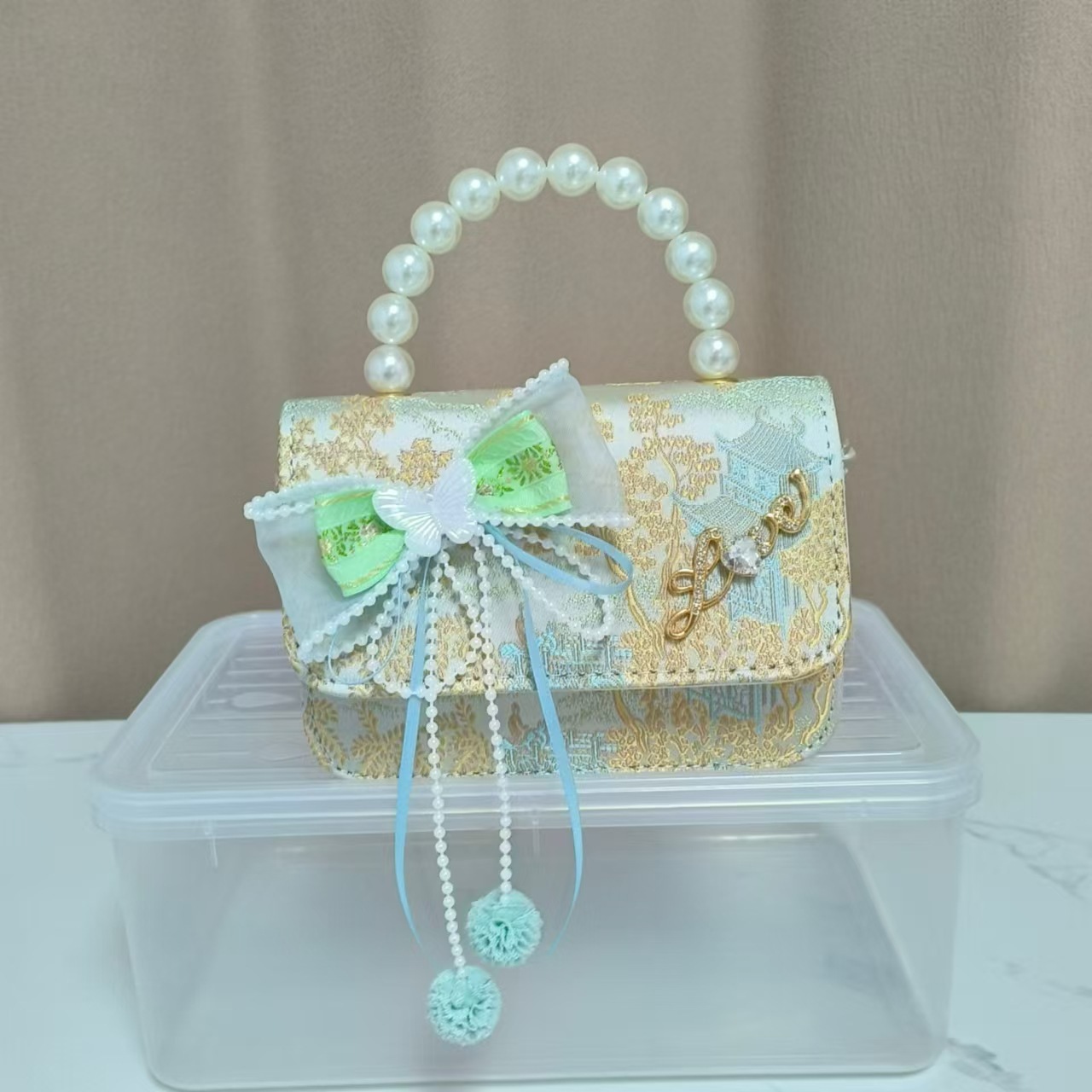 Bolsos infantiles de alto nivel antiguo bolso de cambio de niña pequeña princesa de perlas accesorios de ropa Han bolso de almacenamiento