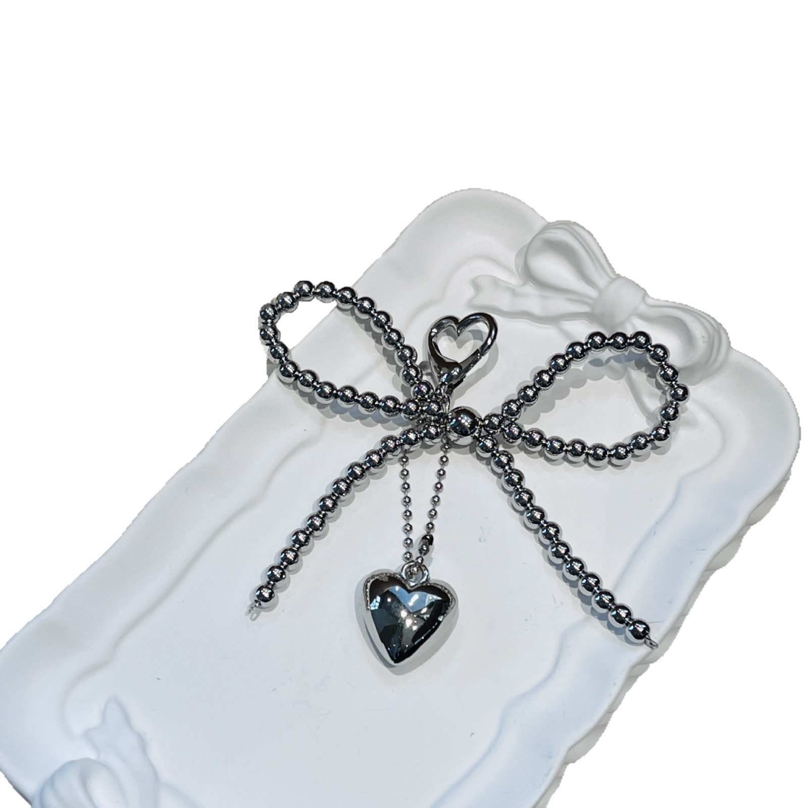 Coreano ins nuevo arco de perla de plata amor colgante llavero auriculares Bluetooth colgante