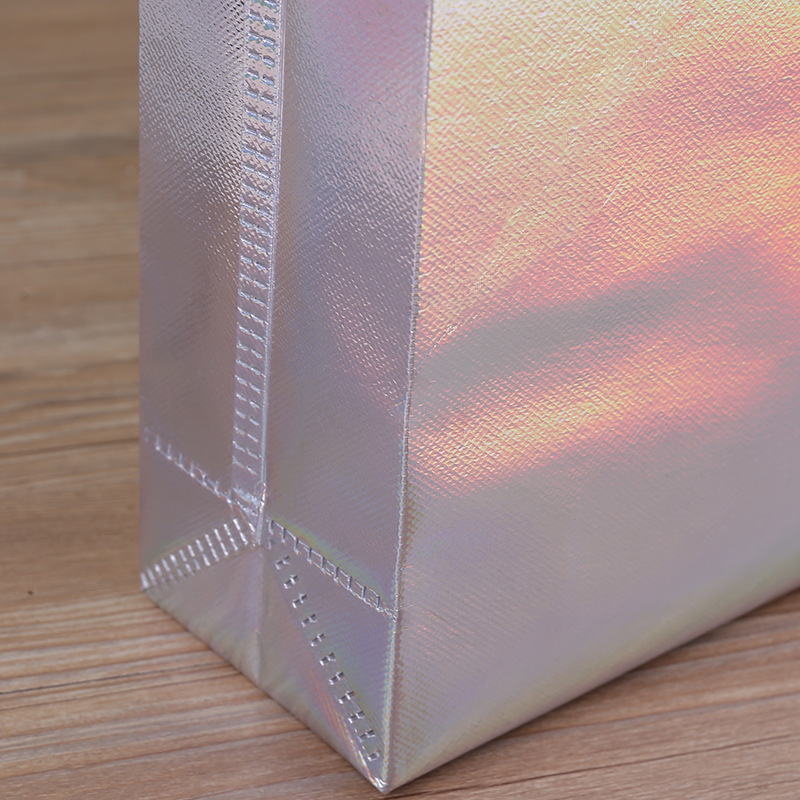 Fabricante spot engrosamiento colorido láser laminada ropa bolso no tejido compras bolsa de regalo de alta gama impresión logotipo