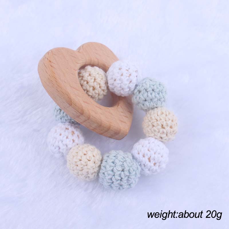 Nueva historieta del bebé haya amor mordedor juguete DIY macaron gran bola de lana mordedura pulsera