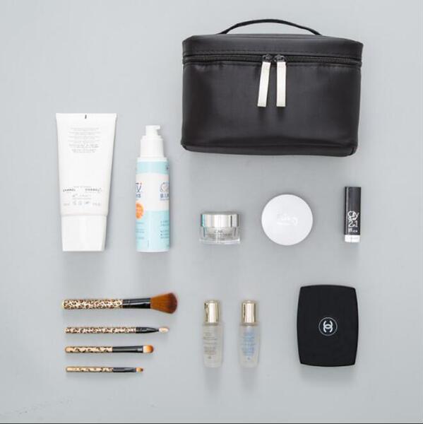 Capacious handheld cosmetic bag